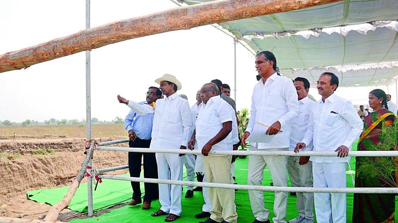Chief Minister K. Chandrasekhar Rao inspects construction works of Korata-Chanaka barrage, being taken up on river Penganga on the state borders on Tuesday. Ministers Jogu Ramanna, T. Harish Rao and Etala Rajender are also seen. (Photo: DC)