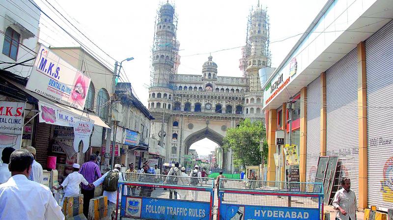 Flooring work underway at the Charminar as part of the Pedestrian Project. The new high-rises coming up around the monument give a contrast look to the space. (P.Surendra)