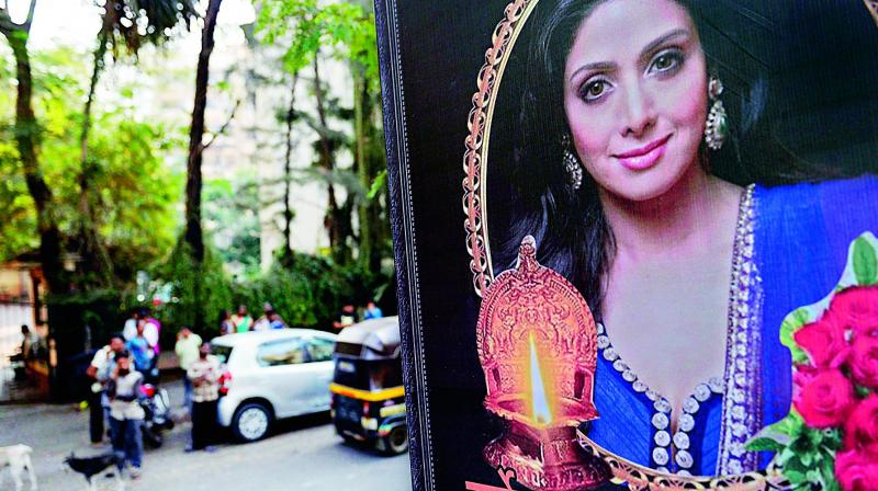 People outside actress Sridevis residence in Mumbai on Tuesday. (Photo: PTI )