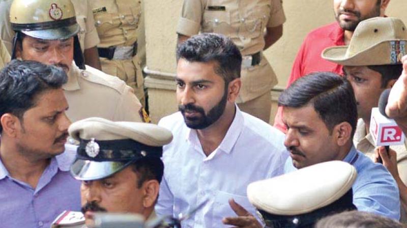 A file photo of Mohammed Nalapad Haris being taken to the sessions court in Bengaluru.