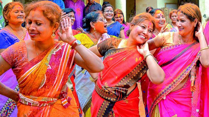 BJP party workers celebrate partys win in North-East states Assembly Election, in Guwahati on Saturday. (Photo: PTI)