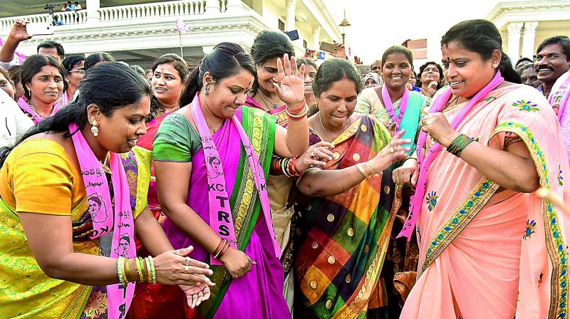 TRS party workers dance at the meet. (Photo: DC)