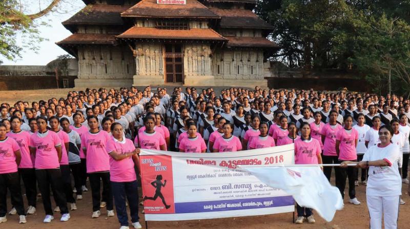 ADGP Dr. B. Sandhya flags off a womens marathon as part of International Womens Day at Thekkinkad Maidan in Thrissur on Wednesday. (Photo: Anup K. Venu)