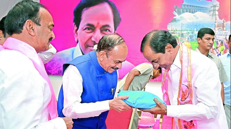 Chief Minister K. Chandrasekhar Rao (right), Deputy Chief Minister Md. Mohamood Ali (centre) and finance minister Etela Rajendra (left) during TRS Legislative Party meeting in Hyderabad on Sunday. (Photo: DC)