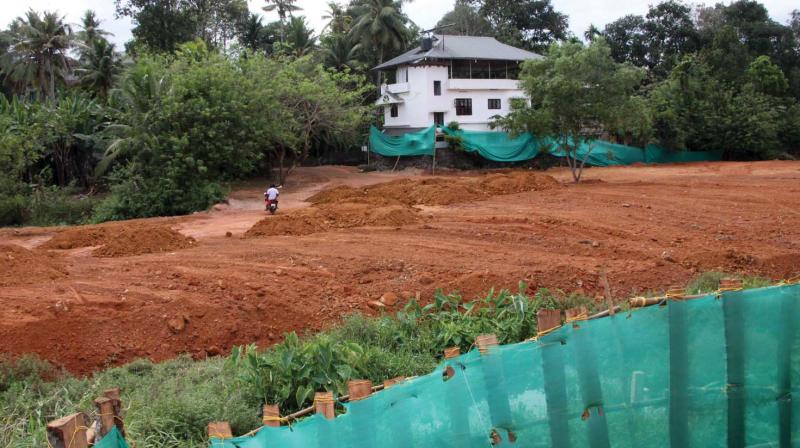 The filling of land at Pulikalchira near Eranjal in Kottayam has been going on at brisk pace. (Photo: Rajeev Prasad)