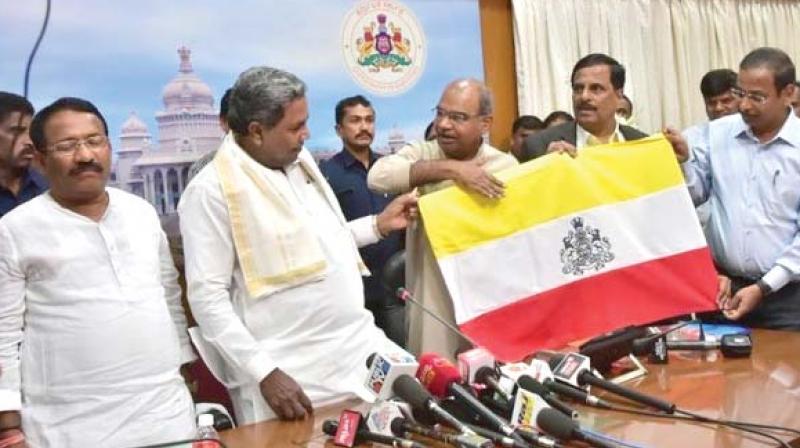 A file picture of CM Siddaramaiah launching Karnataka flag in Bengaluru.