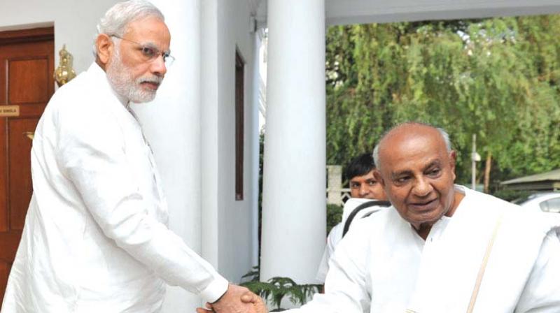 A file photo of JD(S) supremo H.D. Deve Gowda with PM Modi.