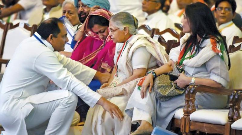 Former Delhi chief minister Sheila Dikshit speaks with Congress leader Mohammad Azharuddin during the 84th Plenary Session of Indian National Congress at the Indira Gandhi Stadium in New Delhi. (Photo: PTI)
