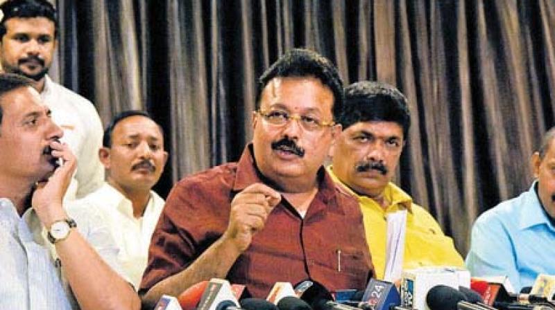 A file photo of rebel JD(S) MLAs led by Cheluvarayaswamy addressing reporters in Bengaluru.