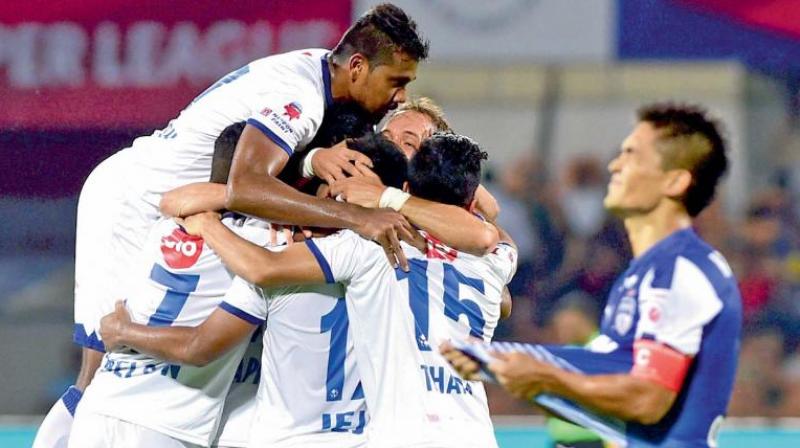 Chennaiyin FC players celebrate their 3-2 win over Bengaluru FC in their Indian Super League final at the Sree Kanteerava Stadium in Bengaluru. (Photo: AFP)
