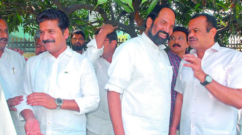 TPCC president Uttam Kumar Reddy listens to expelled MLA Komatireddy Venkata Reddy after a party meet at CLP leader K. Jana Reddys residence in Hyderabad on Tuesday. Congress leader Revanth Reddy too could be seen. 	(Photo: DC)