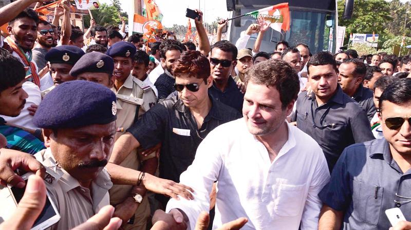 Congress president Rahul Gandhi with party supporters during the Janaashirvada Yatra in Mulki on Tuesday.