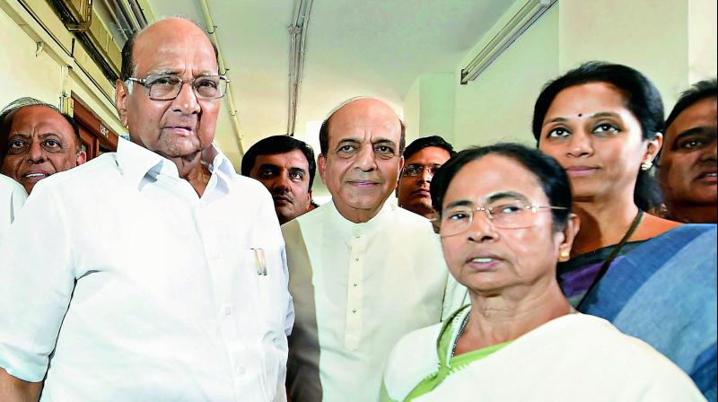 West Bengal Chief Minister and TMC chief Mamata Benerjee with NCP chief Sharad Pawar after a meeting at Parliament house in New Delhi on Tuesday. (Photo: PTI)