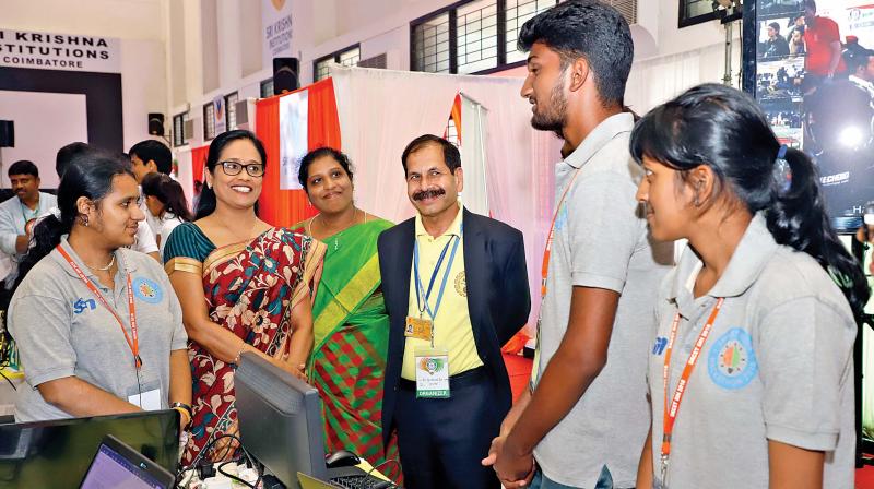 S. Malarvizhi, chairperson and managing trustee of Sri Krishna Institutions, interacts with participants of Smart India Hackathon 2018 held in Coimbatore. (Photo: DC)