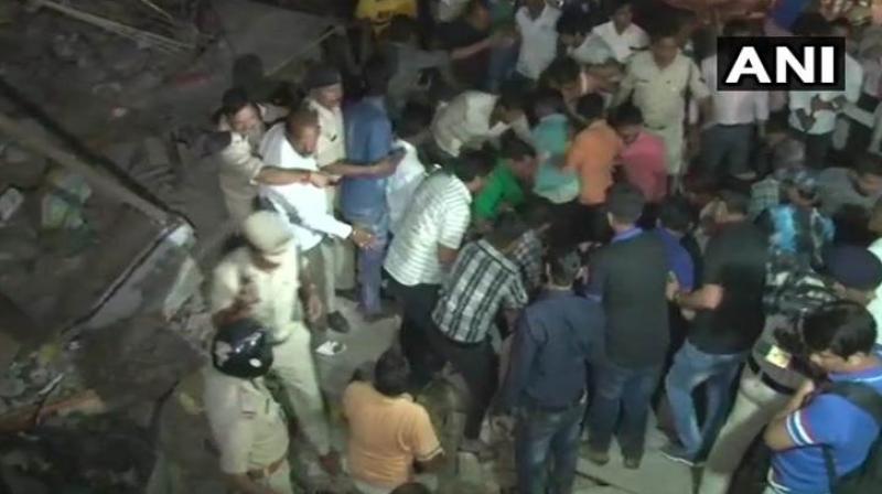 A three-story building collapsed near Sarvate Bus Stand at around 10 pm on Saturday. Rescue operations are underway (Photo: Twitter/ANI)