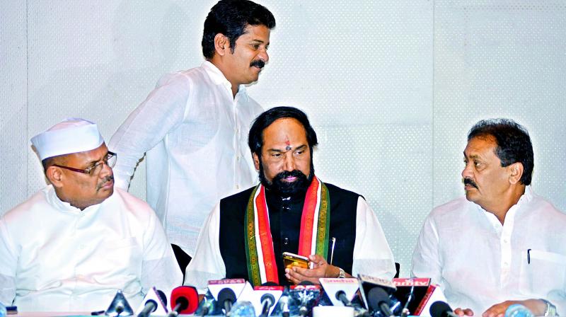 TPCC chief Uttam Kumar Reddy flanked by AICC general secretary in-charge for Telangana Dr R.C. Kuntia and Shabbir Ali addresses the media on Sunday. Congress leader Revanth Reddy could also be seen in the photograph. 	(Photo: DC)