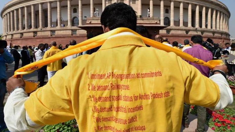 TDP MPs protest at the forecourt of the Parliament demanding special status for Andhra Pradesh Thursday. (Photo: PTI)