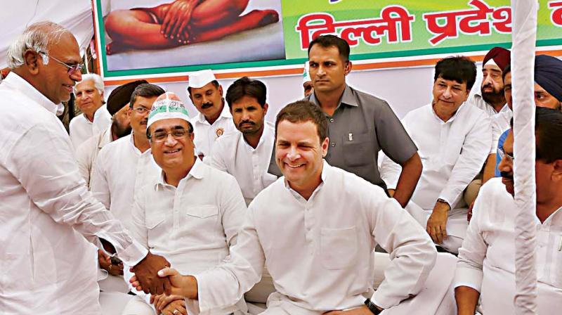 Congress president Rahul Gandhi with party leaders Ajay Maken and Mallikarjun Kharge at a nationwide day-long fast against caste violence, at Rajghat in New Delhi. (Photo: PTI)