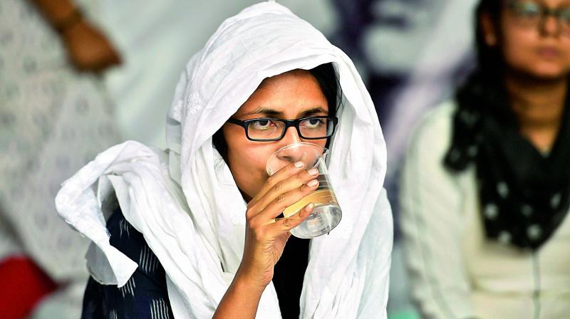 Delhi Commission for Women (DCW) Chief Swati Maliwal drinks water on the eight-day of her hunger strike against recent Unnao and Kathua rape cases in New Delhi, on Friday. (Photo: PTI)