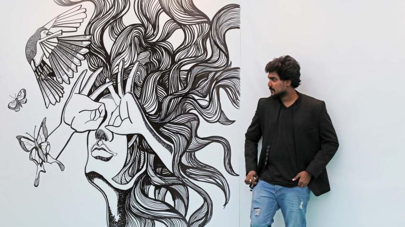 Sijin with his doodle at World Art Dubai.
