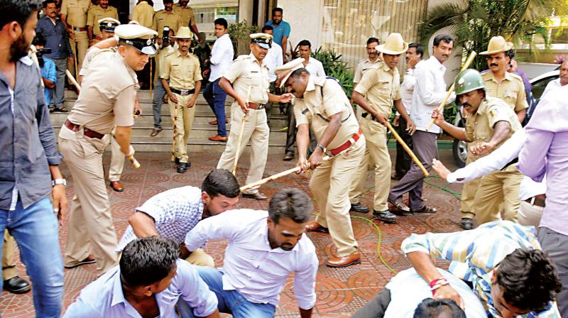 Police cane BJP workers protesting in Mysuru on Tuesday against denial of ticket to B.Y. Vijayendra  for the Varuna constituency. (Photo: KPN)