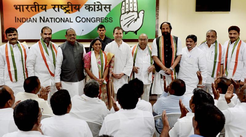 Congress president Rahul Gandhi with Dr. Nagam Janardhan Reddy, G Surya Kiran and other Telangana leaders who joined the party at the AICC  headquarter in New Delhi on Wednesday. (Photo: PTI)