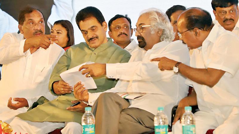 Former adviser to Prime Minister of India, Sam Pitroda (2nd R), with senior Congress leaders Veerappa Moily and K.C. Venugopal, and Bengaluru Development Minister K.J. George at the release of Congress party manifesto in Bengaluru on Saturday. (Photo: DC)