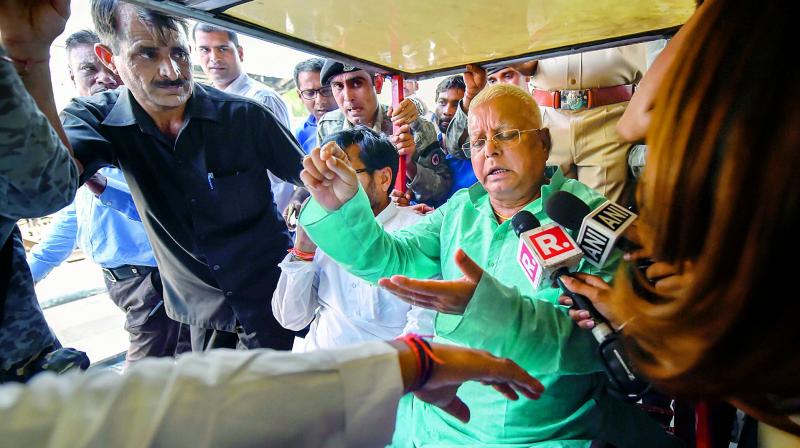 RJD Chief Lalu Prasad Yadav speaks to the media at New Delhi Railway station in New Delhi on Monday. (Photo: PTI)