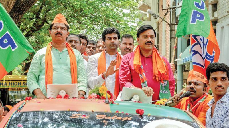 Tainted mining baron Janardhan Reddy joins BJP leader R. Ashok and candidate Lallesh Reddy in Bengaluru recently.