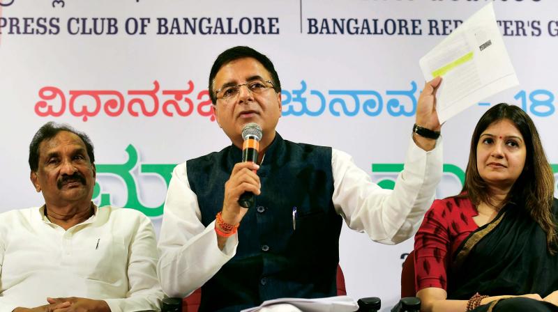 AICCs media in-charge Randeep Singh Surjewala addresses the media along with Bengaluru Development Minister K.J. George party and spokesperson Priyanka Chaturvedi in Bengaluru on Tuesday.