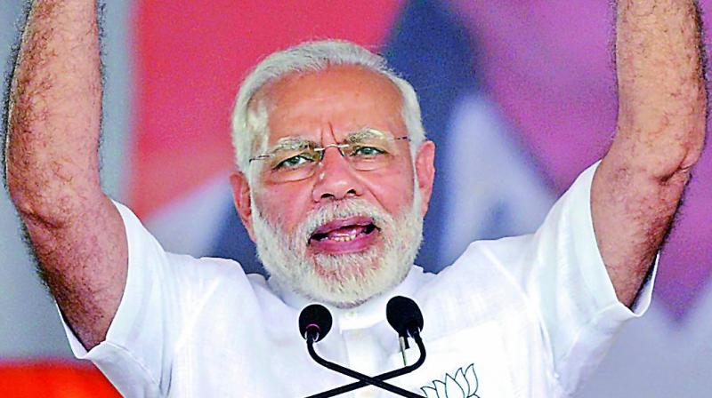 Prime Minister Narendra Modi gestures as he speaks during a public rally ahead of the Karnataka Assembly Election 2018 in Tumakuru on Saturday. (Photo: PTI)