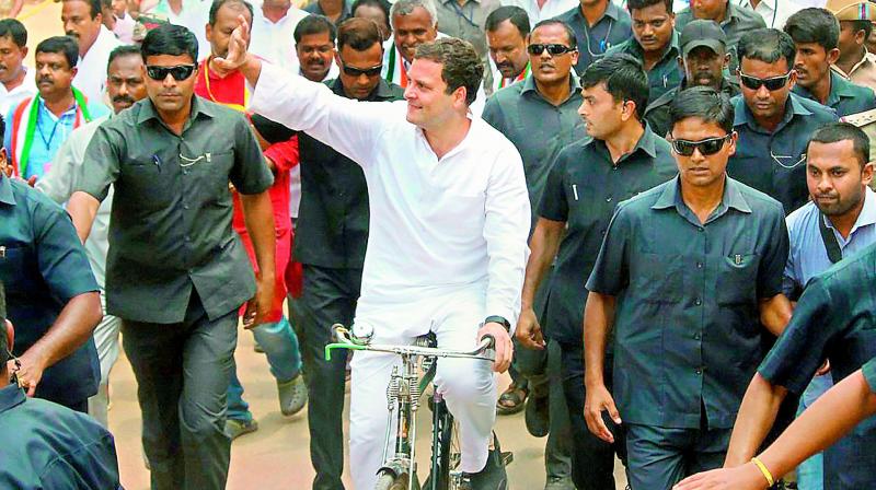 Congress President Rahul Gandhi rides a bicycle to protest against the fuel price hike at Malur in Kolar district on Monday. (Photo: PTI)