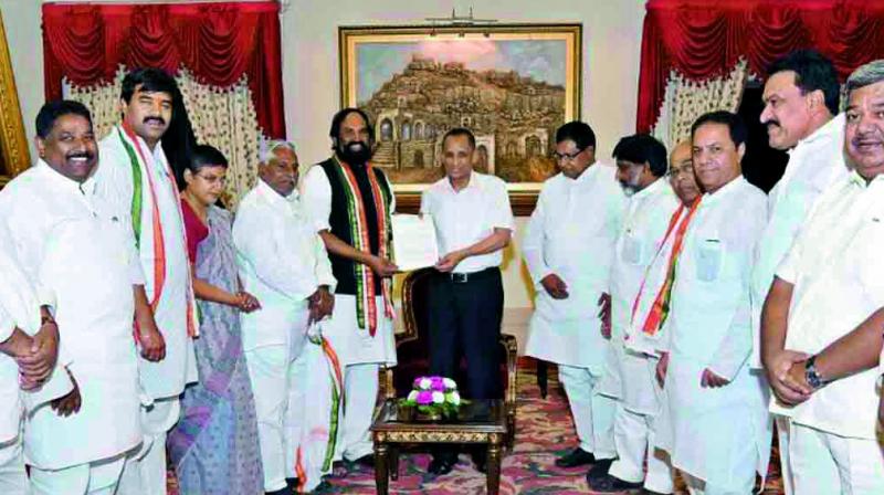 Delegation, led by TPCC president N. Uttam Kumar Reddy, submits a memorandum to Governor E.S.L. Narasimhan at Raj Bhavan in Hyderabad on Monday.