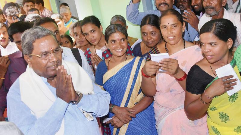 CM Siddaramaiah meets his supporters after casting his vote in Varuna on Saturday. (Photo:DC)