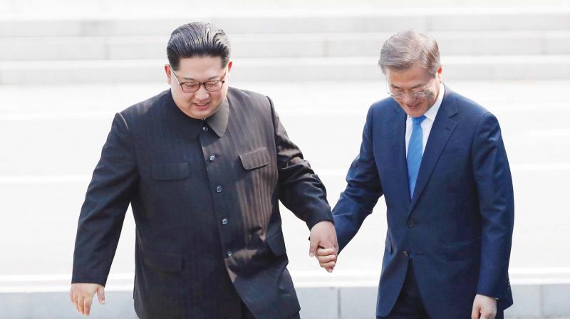 North Korean leader Kim Jong Un, left, and South Korean President Moon Jae-in embrace each other. (Photo: AP/File)