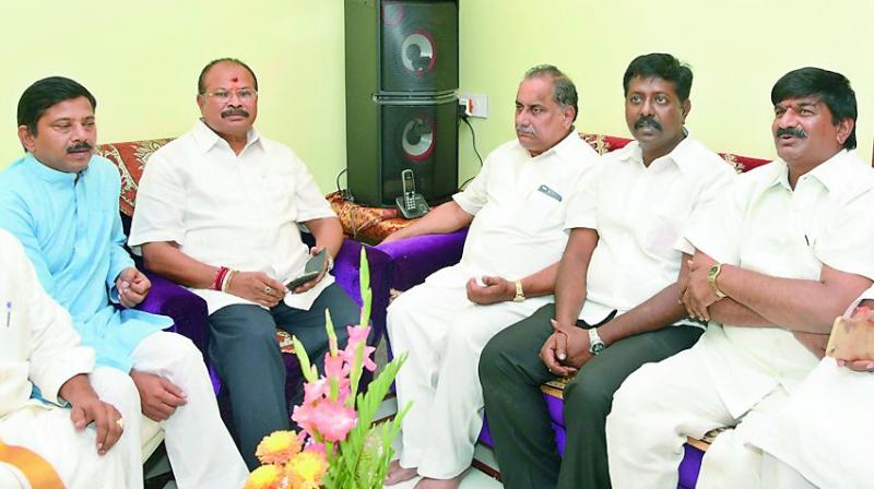 Former minister and Kapu community leader M. Padmanabham meets former minister K. Lakshminarayana on being elected as AP BJP president at the latters residence in Guntur city on Sunday. (Photo: DC)