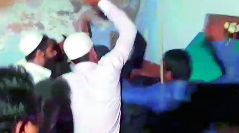 A video grab of a mob led by MIM Malakpet MLA Ahmed Bin Abdullah Balala beating up a rape accused on Friday night. The video has gone viral on the social media.