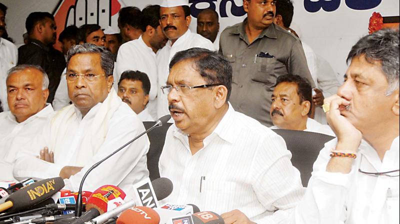 KPCC chief Dr G. Parameshwar addresses the media along with former CM Siddaramaiah and former minister Ramalinga Reddy in Bengaluru on Monday. (Photo: DC)