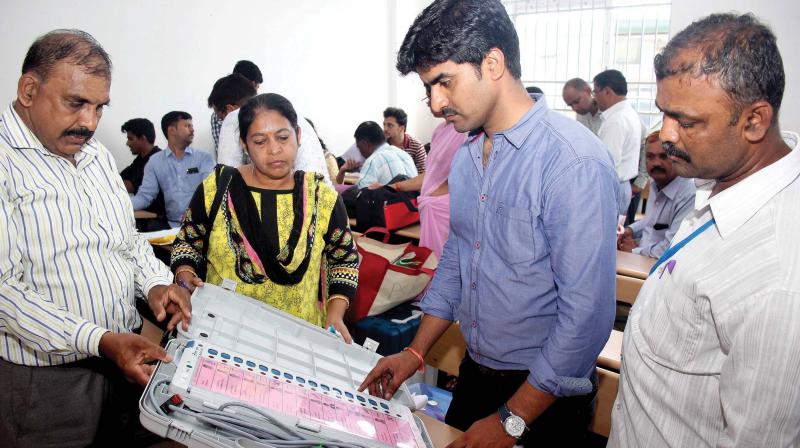 Election Commission officials make preparations for RR Nagar bypoll at Jnanakshi Vidyaniketan School in Bengaluru on Sunday.  (Photo: DC)