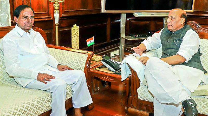 Telangana Chief Minister K. Chandrashekar Rao with home minister Rajnath Singh in New Delhi on Monday.