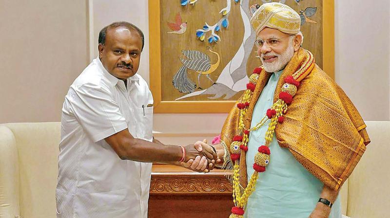 Chief Minister HD Kumaraswamy meets Prime Minister Narendra Modi, in New Delhi on Monday. The CM said the discussion with the PM went on for over an hour, with Mr Kumaraswamy requesting him to  supply coal to the state to keep the three thermal plants at Ballari, Yeramaras and Raichur running. (Photo: PTI)