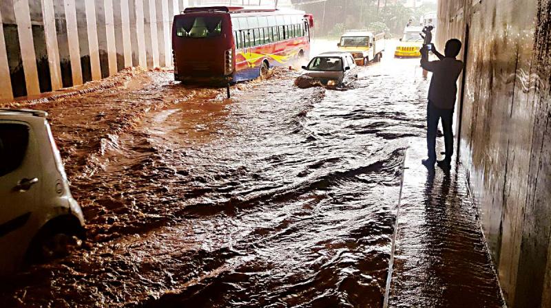 The Padil underpass on the Mangaluru-Bengaluru highway was flooded after rains lashed the port city on Tuesday. (Photo:  DC)