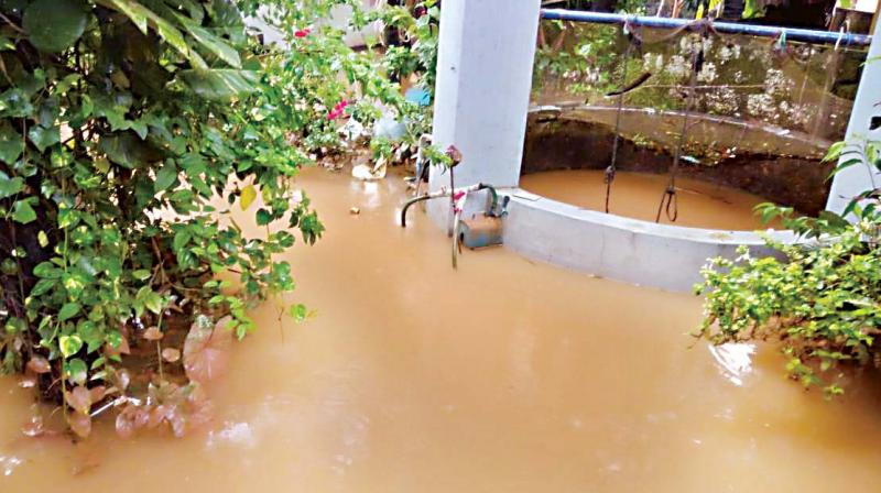 A well flooded after heavy rain hit Mangaluru. (Photo: DC)