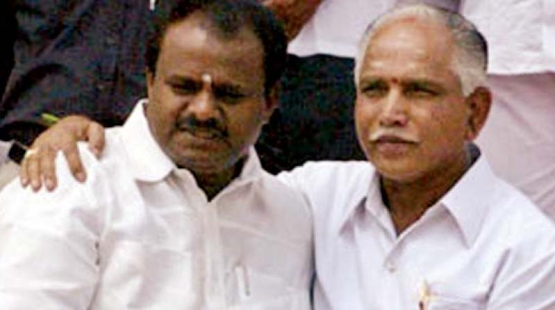 IN HAPPIER TIMES: Chief Minister H.D. Kumarswamy with former chief minister B.S. Yeddyurappa.