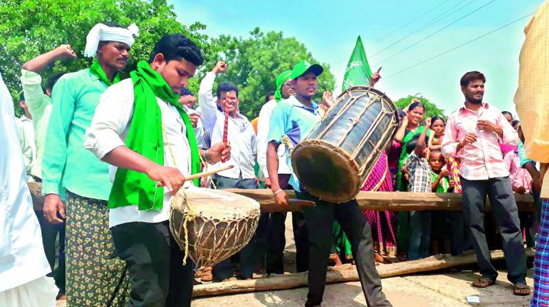Members of the tribal community beat traditional drums to declare self-rule under the special provisions of the Constitution at Kothaguda in Utnoor mandal in old Adilabad district on Friday.  (Photo: DC)