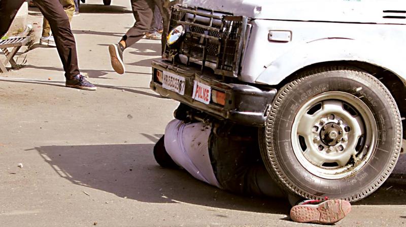 A CRPF vehicle mows down a youth during protests after congregational prayers at the historic Jamia Masjid 	 H.U. Naqash