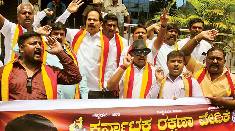 Members of the Karnataka Rakshana Vedike stage a protest at Karnataka Film Chamber in Bengaluru on Saturday against the release of Kaala. (Photo: DC)