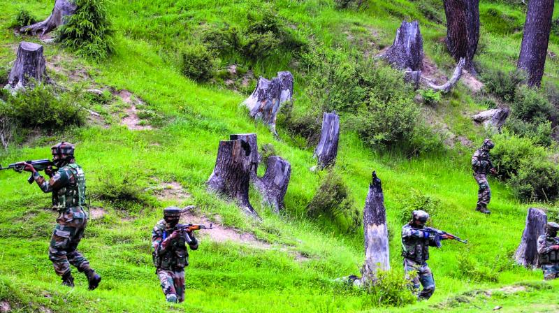 Army personnel take positions during an encounter with the militants in Keran sector of Kupwara district of north Kashmir on Sunday. (Photo: PTI )