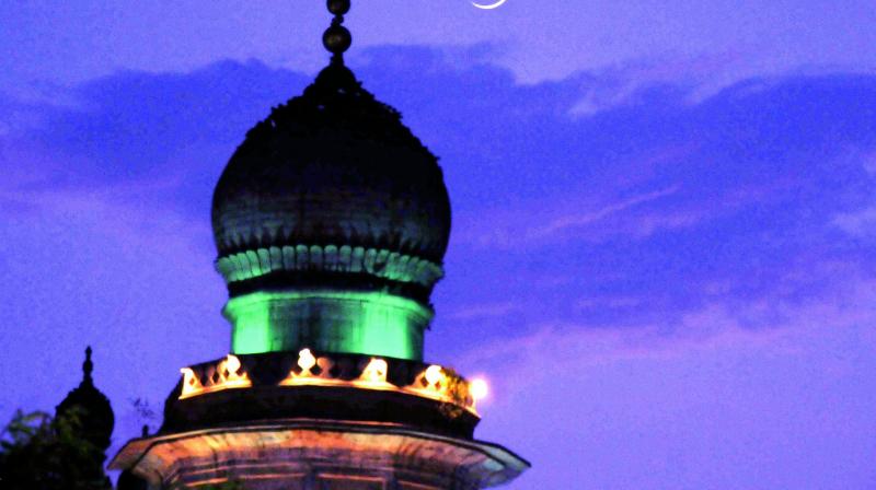 The crescent moon rises over Charminar on Friday. Id-ul-Fitr will be celebrated in Telangana state and Andhra Pradesh on Saturday. DC wishes all its readers Id Mubarak. (Photo: P.Surendra)