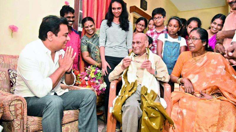 Minister K.T. Rama Rao greets Mitta Yadava Reddy, who had participated in the 1960s Telangana movement, at Habsiguda, Hyderabad on Sunday. The minister visited Mr Reddys home on the latters birthday on the invitation of his grand daughter Nidhi Reddy to launch his book Na Gnyapakalu. (Photo: DC)
